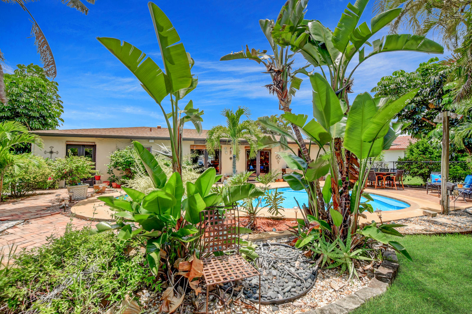 4542 Avalon Street Boca Raton, FL 33428 - Photo 34 of 51 a view of a backyard with plants and garden