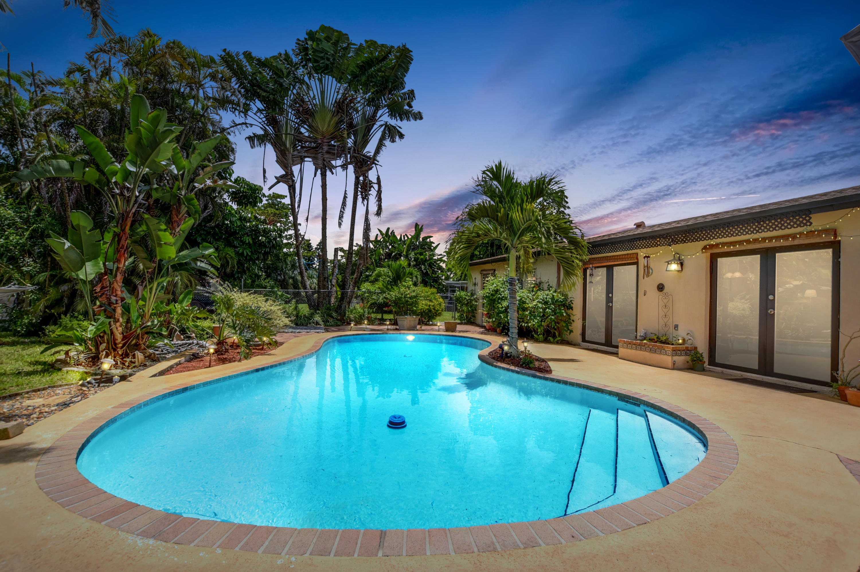 4542 Avalon Street Boca Raton, FL 33428 - Photo 37 of 51 a view of swimming pool with a yard