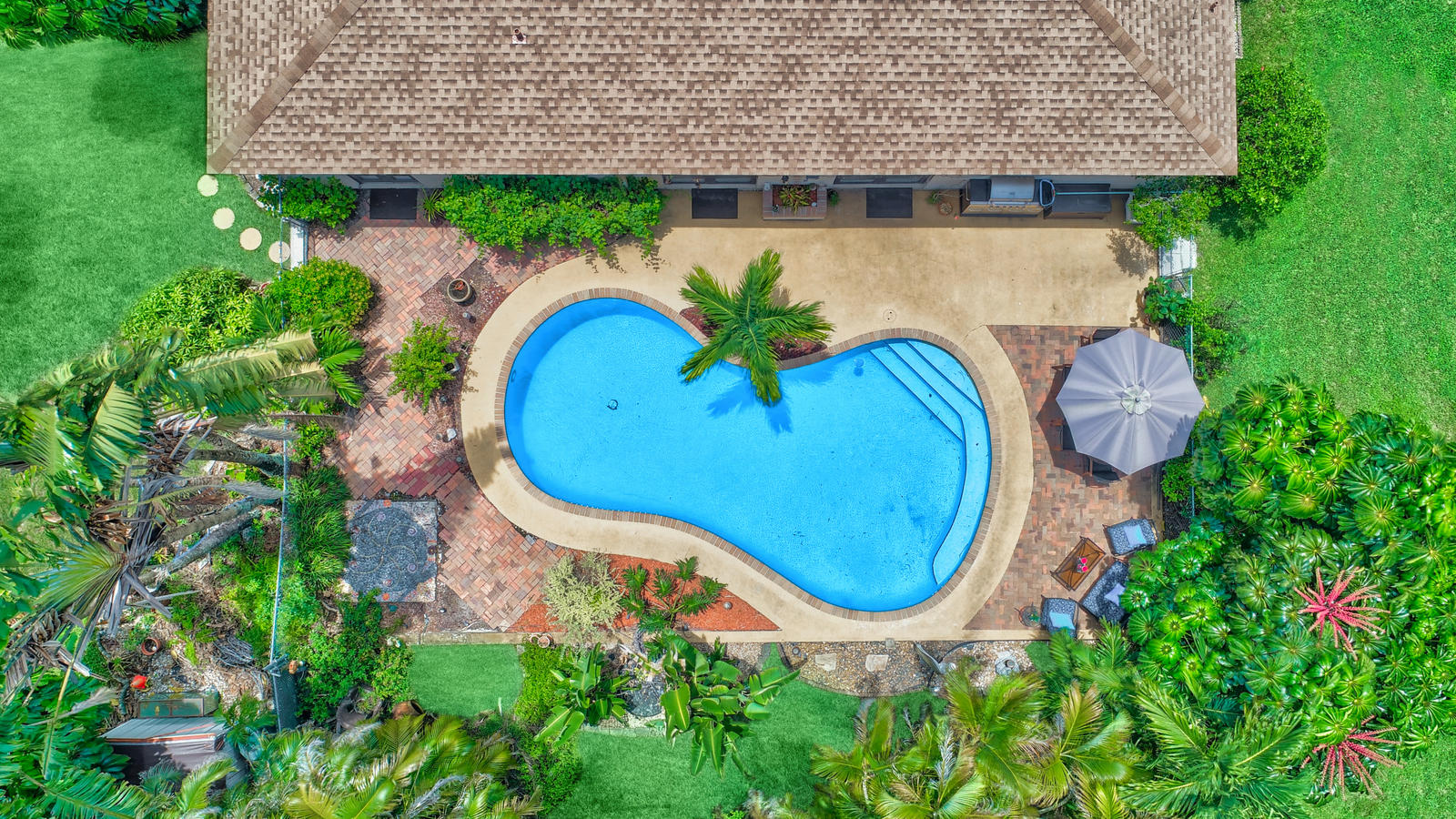 4542 Avalon Street Boca Raton, FL 33428 - Photo 4 of 51 an aerial view of a garden