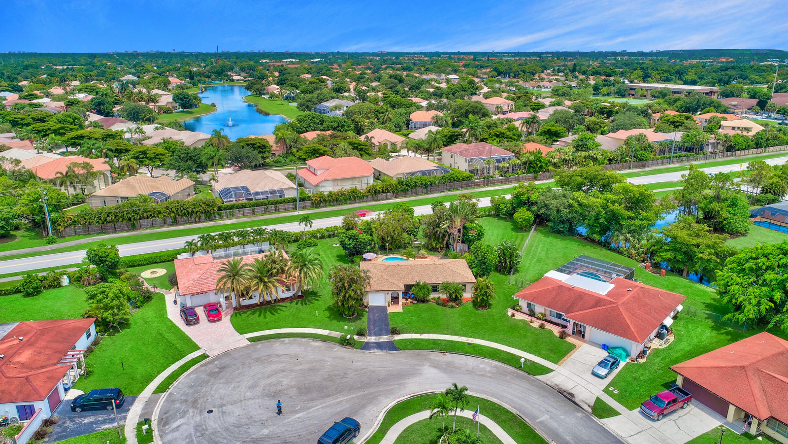 4542 Avalon Street Boca Raton, FL 33428 - Photo 45 of 51 an aerial view of a house with a garden
