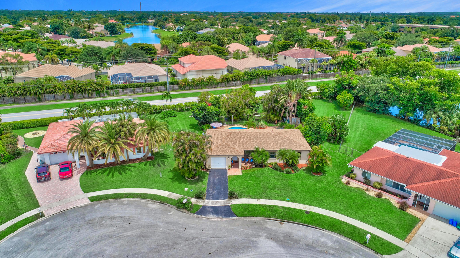 4542 Avalon Street Boca Raton, FL 33428 - Photo 48 of 51 a view of yard with swimming pool and outdoor seating