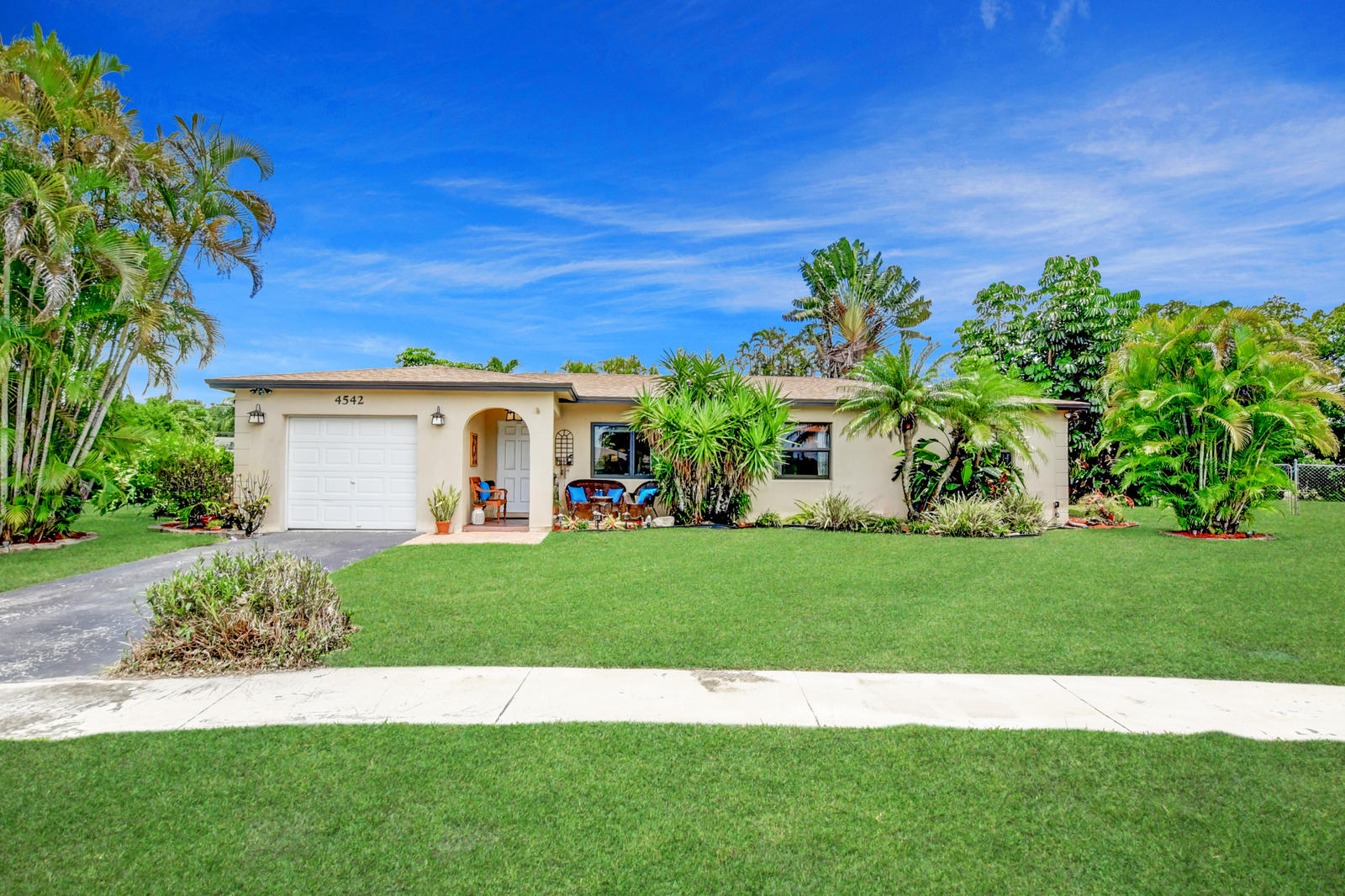 4542 Avalon Street Boca Raton, FL 33428 - Photo 50 of 51 a view of a yard with a house
