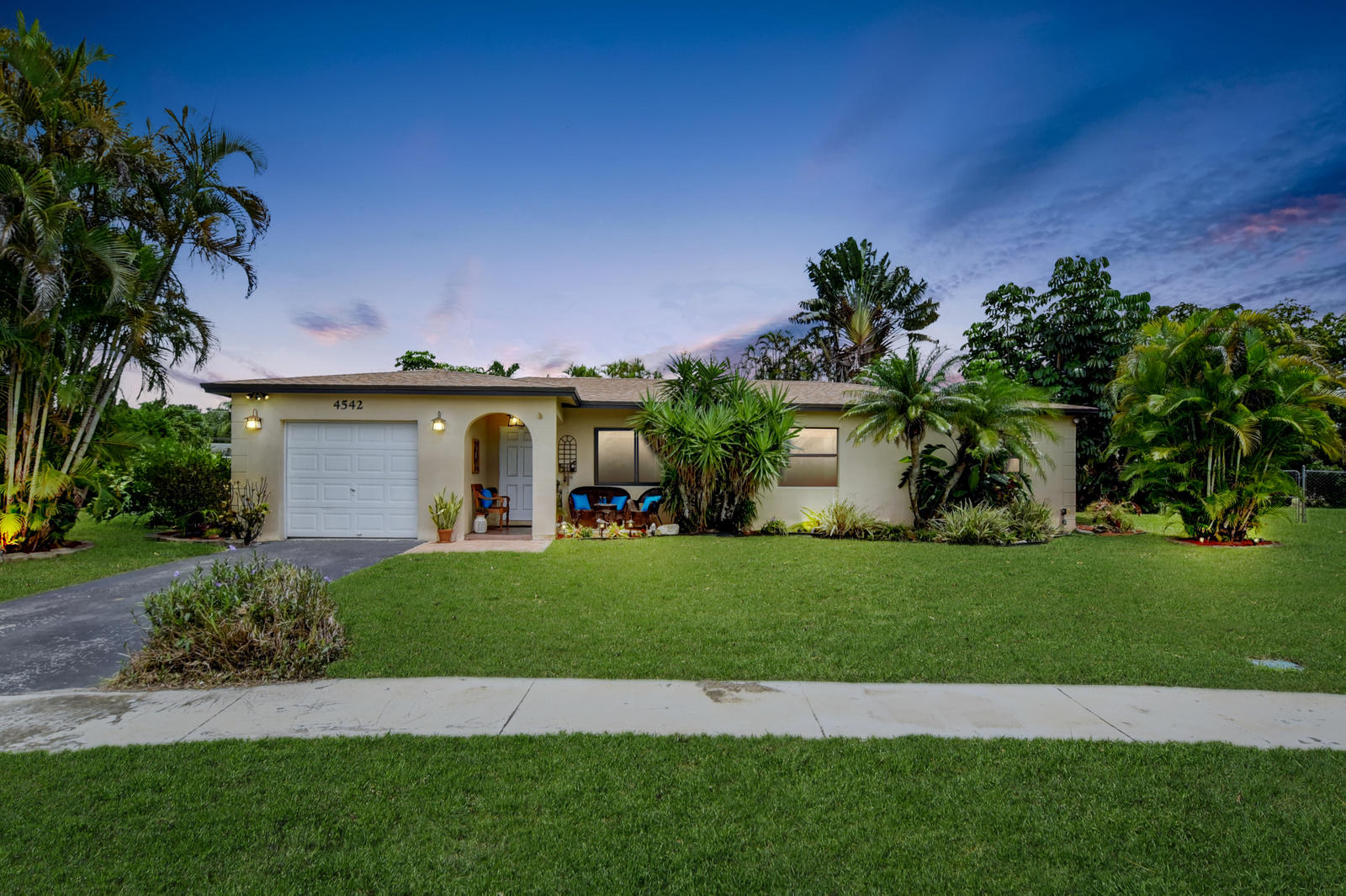 4542 Avalon Street Boca Raton, FL 33428 - Photo 51 of 51 a front view of a house with a garden