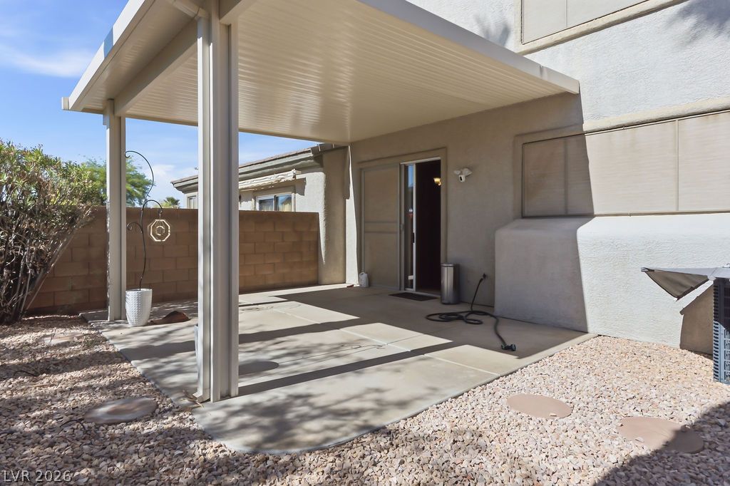 754 Solitude Point Avenue Henderson, NV 89012 - Photo 19 of 38 An inviting covered patio offers shaded outdoor relaxation and direct access to the interior.