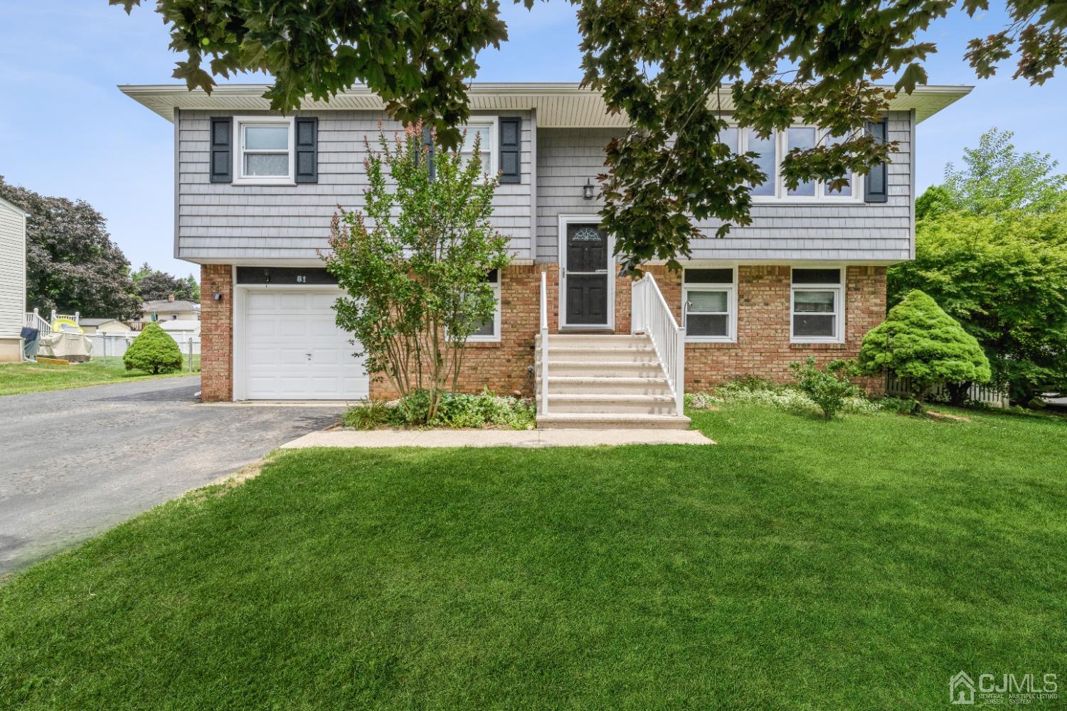 81 Elmont Road Hamilton, NJ 08610 - Photo 1 of 33 a house that has a tree in front of the house