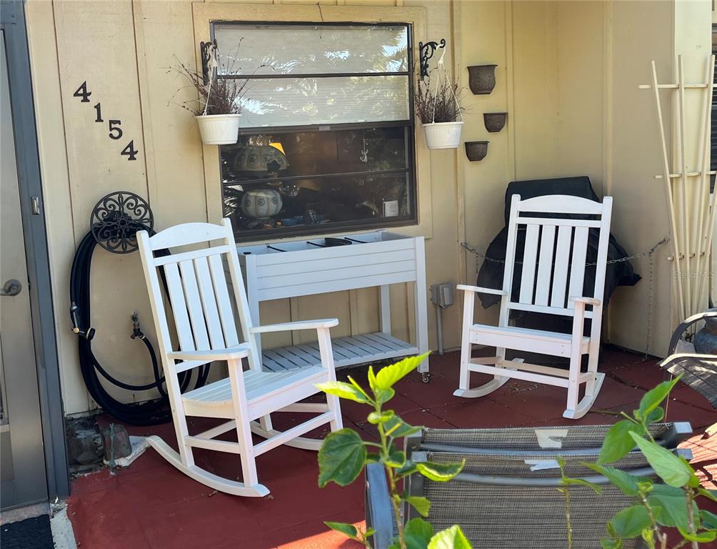 a view of hall way with furniture and chandelier