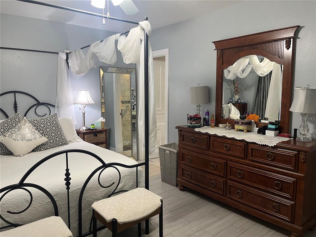 4154 66th St Circle West, Unit 4154 Bradenton, FL 34209 - Photo 11 of 28 a bathroom with a toilet a sink and mirror