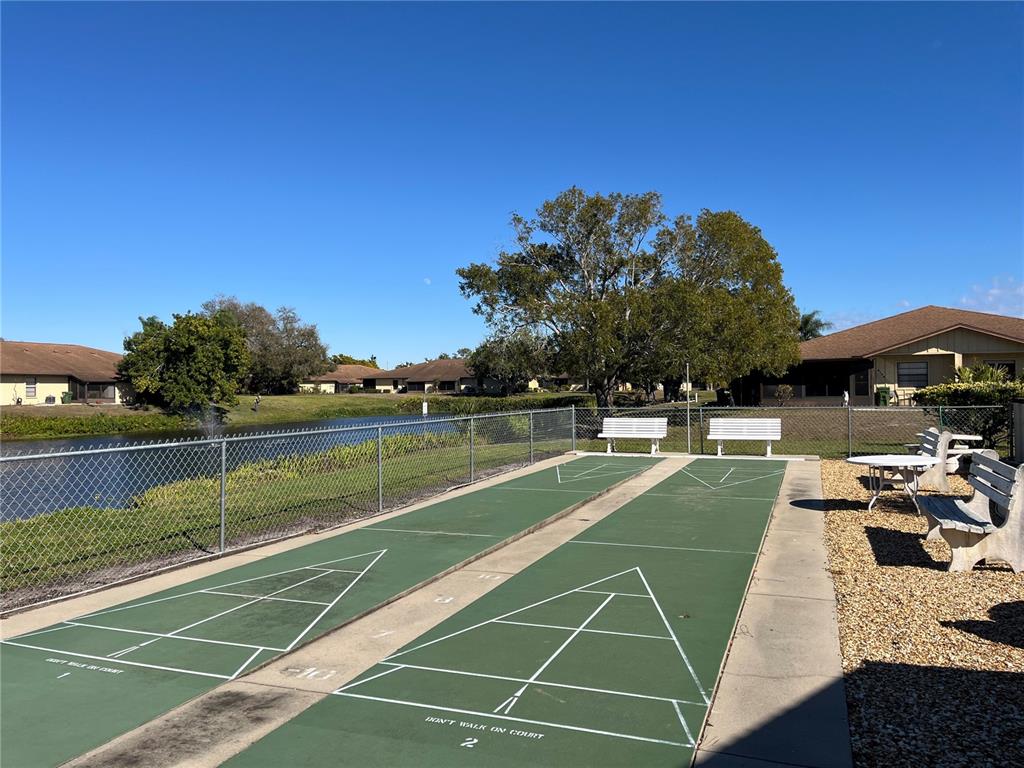 4154 66th St Circle West, Unit 4154 Bradenton, FL 34209 - Photo 26 of 28 a view of a tennis court