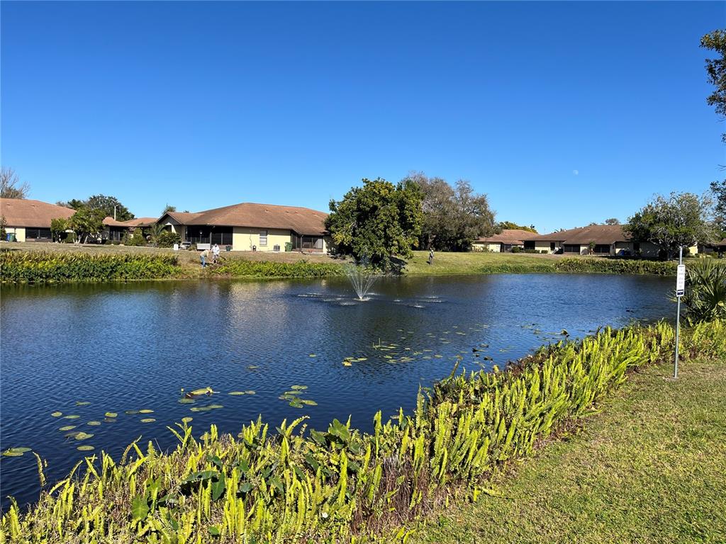 4154 66th St Circle West, Unit 4154 Bradenton, FL 34209 - Photo 27 of 28 a view of a lake with a houses