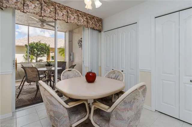 a view of a dining room with furniture and window