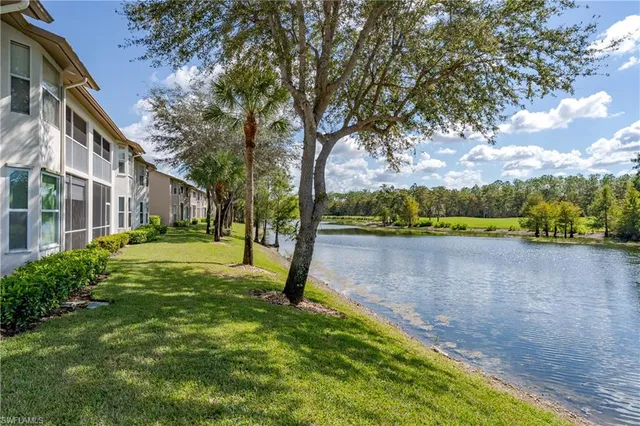 a view of a fountain in front of a house