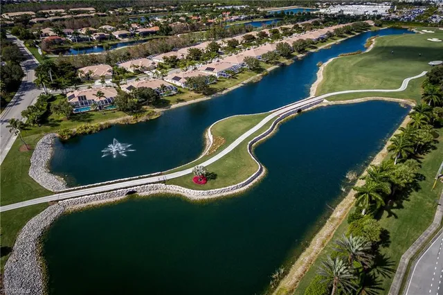an aerial view of a house with a lake view
