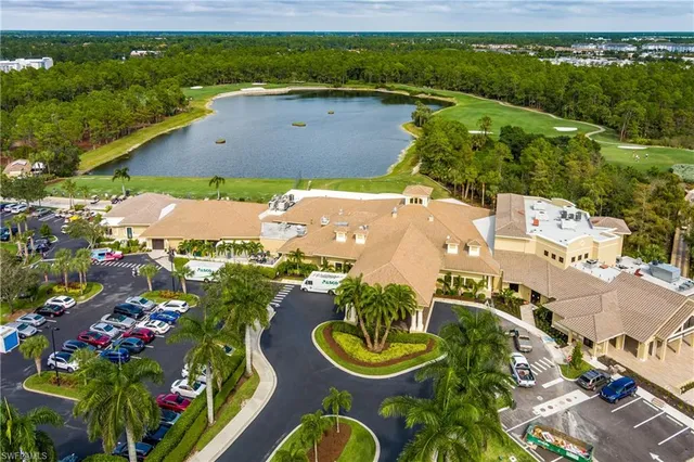 a living room with furniture and chandelier