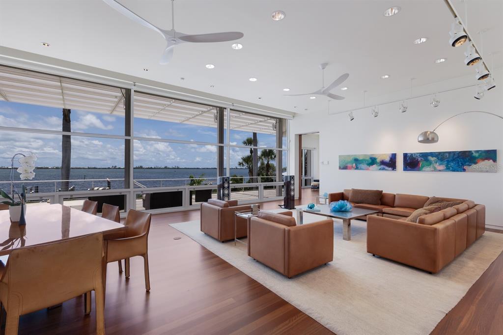 12400 Placida Road Placida, FL 33946 - Photo 1 of 1 a living room with furniture a rug and a large window