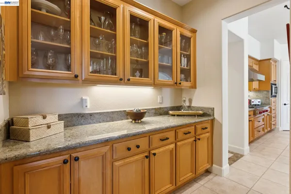 a kitchen with stainless steel appliances granite countertop a sink and cabinets