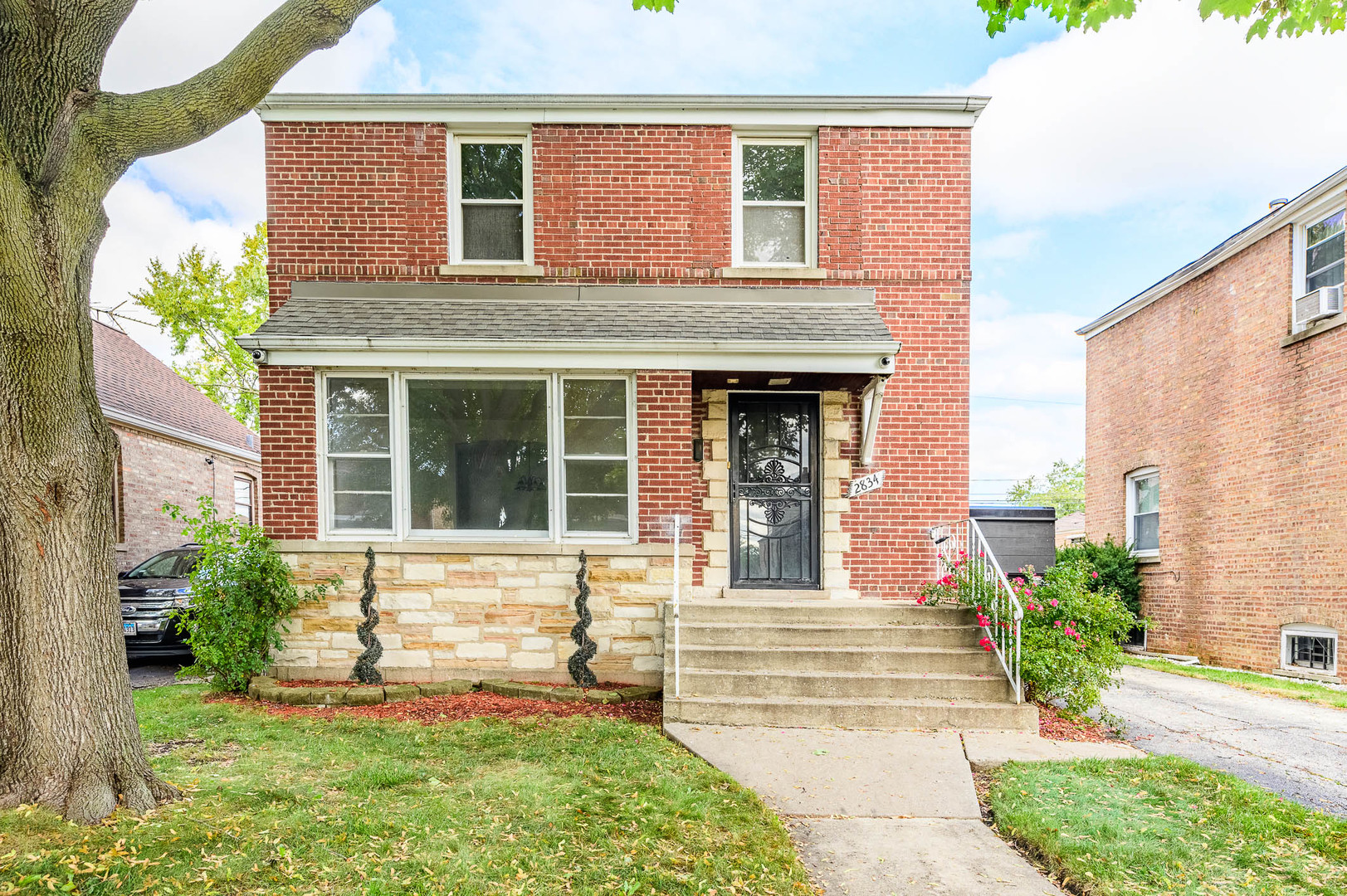 2834 West 85th Place Chicago, IL 60652 - Photo 1 of 17 a front view of a house with garden