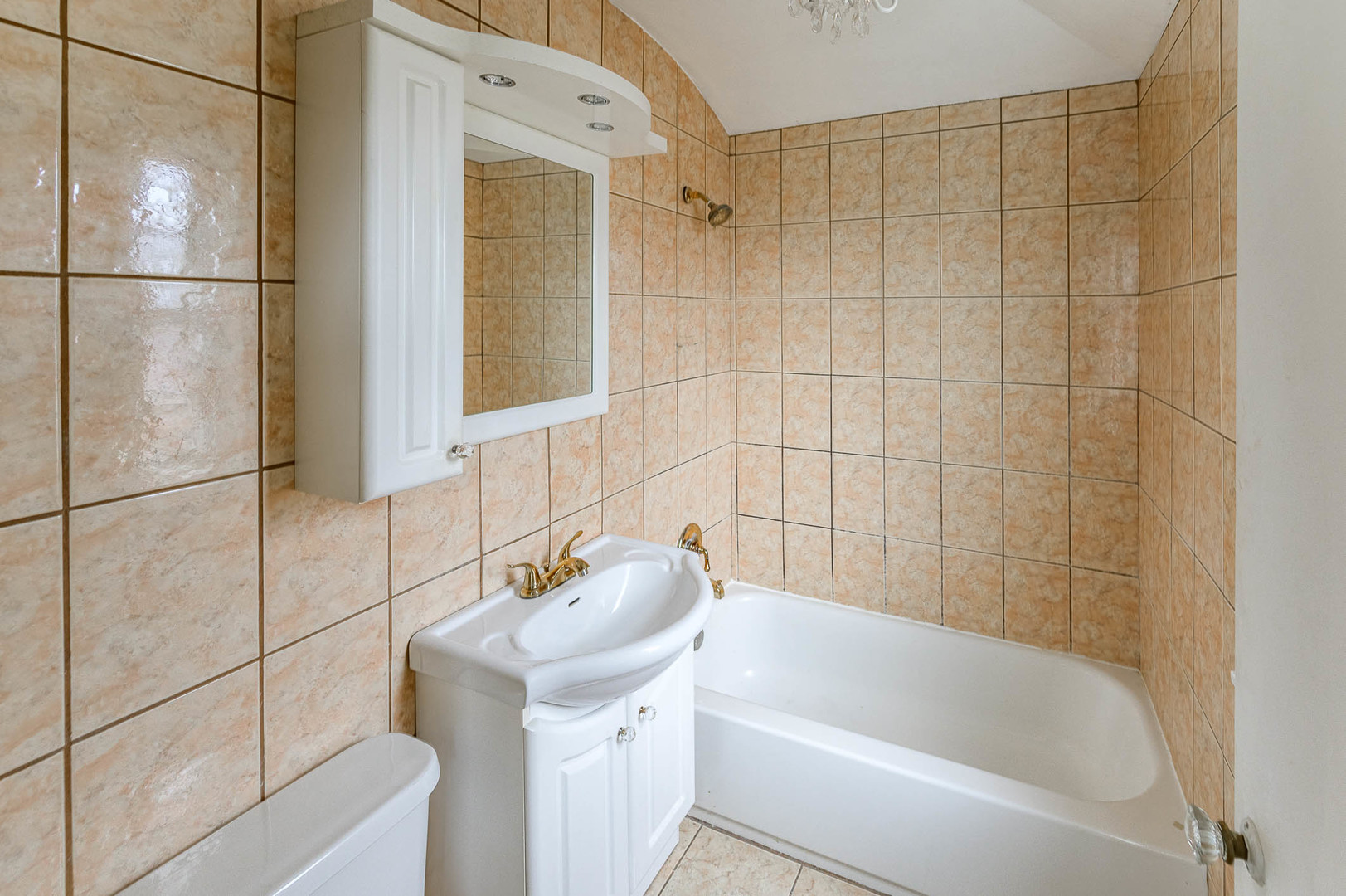 2834 West 85th Place Chicago, IL 60652 - Photo 14 of 17 a bathroom with a tub a sink and a shower