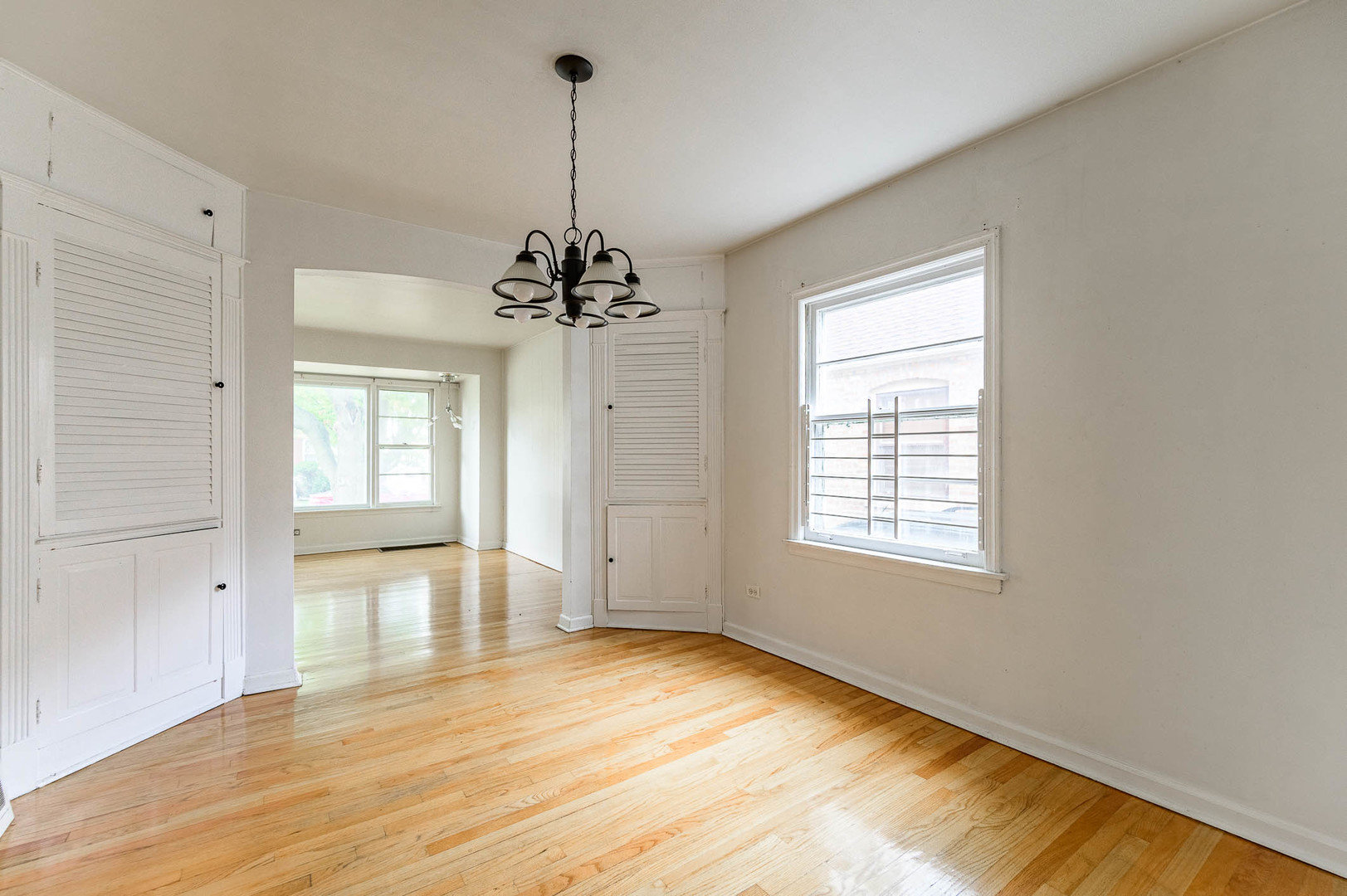 2834 West 85th Place Chicago, IL 60652 - Photo 3 of 17 a view of empty room with wooden floor and fan