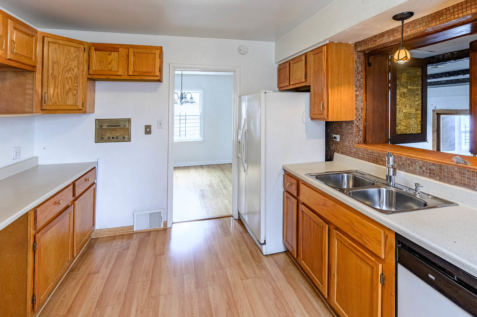 2834 West 85th Place Chicago, IL 60652 - Photo 4 of 17 a kitchen with a sink and refrigerator