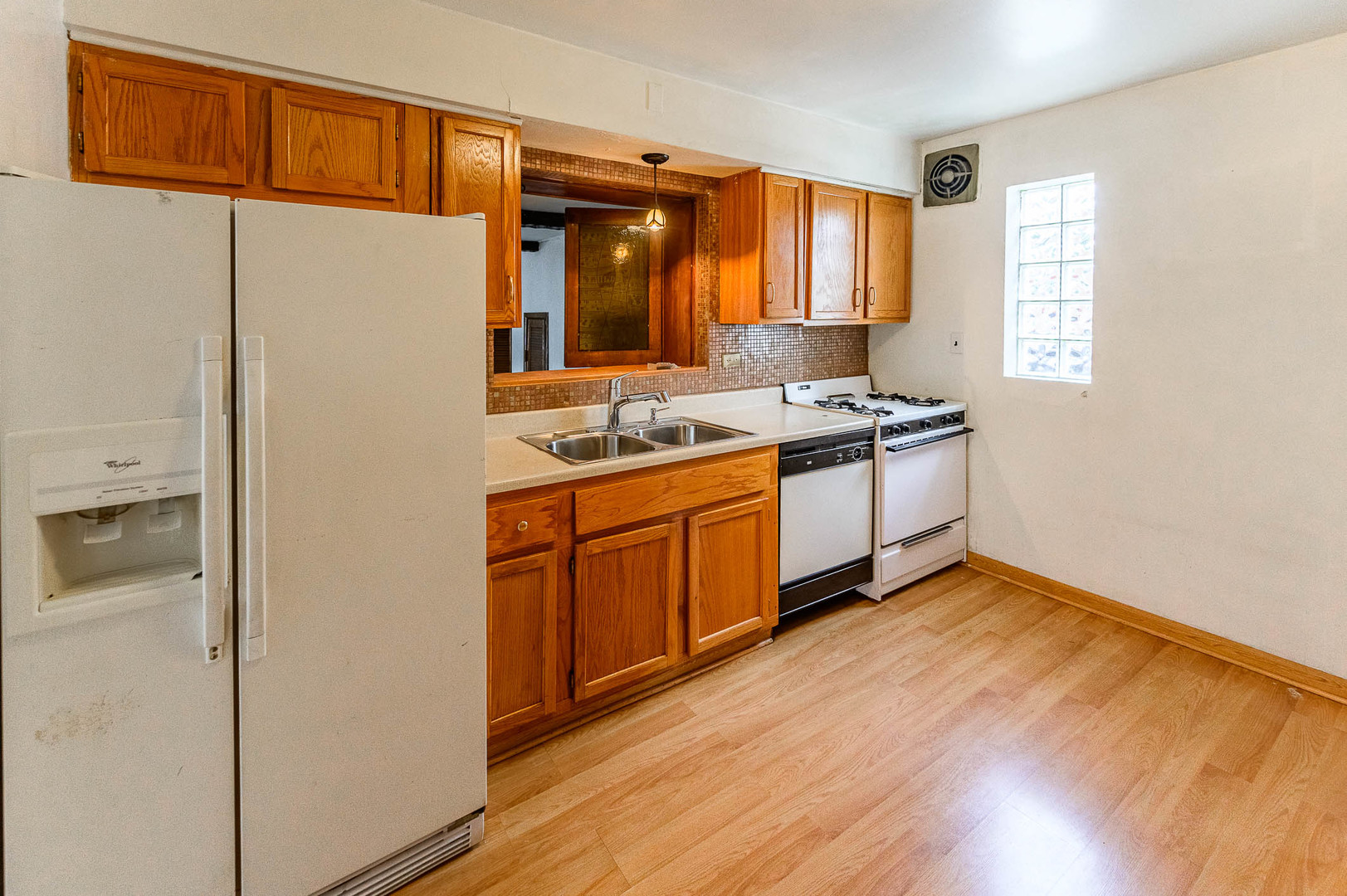 2834 West 85th Place Chicago, IL 60652 - Photo 5 of 17 a kitchen with stainless steel appliances granite countertop a stove a sink and a refrigerator
