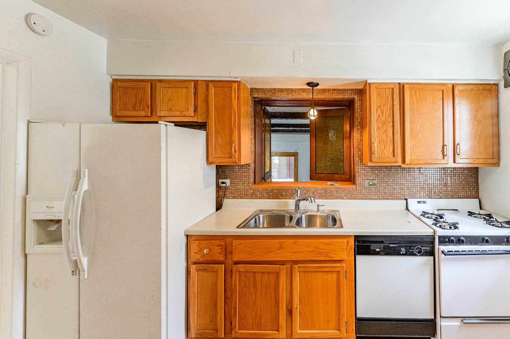 2834 West 85th Place Chicago, IL 60652 - Photo 6 of 17 a utility room with stainless steel appliances granite countertop a refrigerator and a stove
