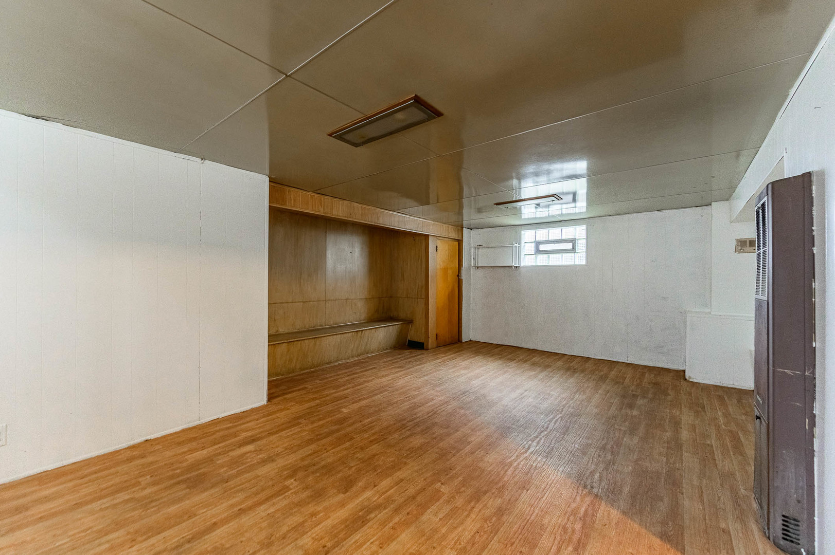 2834 West 85th Place Chicago, IL 60652 - Photo 10 of 17 a view of empty room with wooden floor and fan