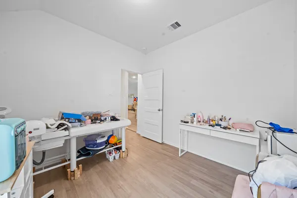 a bathroom with a sink vanity mirror and toilet