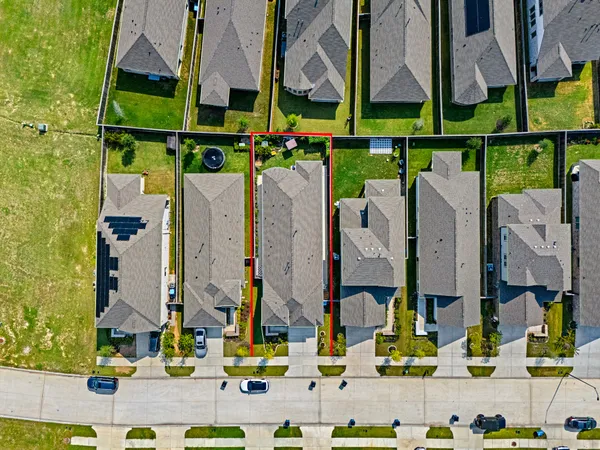 a view of a swimming pool with a yard