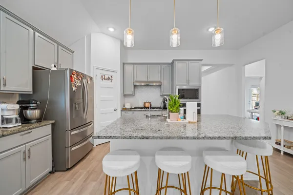 a view of a livingroom with furniture window and wooden floor