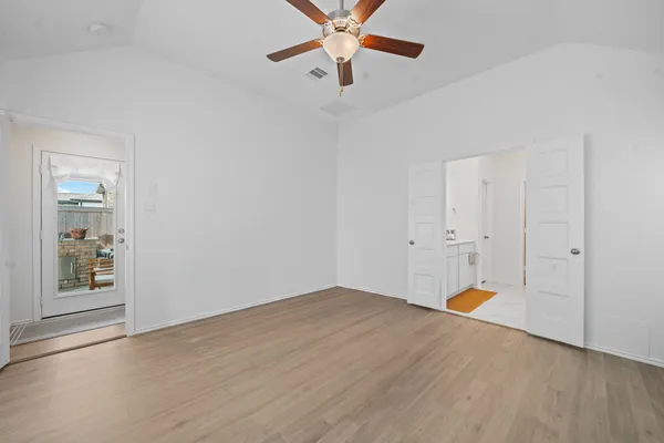 a view of an empty room with a window