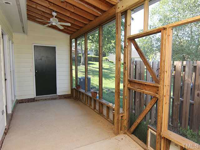 2611 Cottage Circle Raleigh, NC 27613 - Photo 13 of 15 a view of an empty room with wooden floor and windows