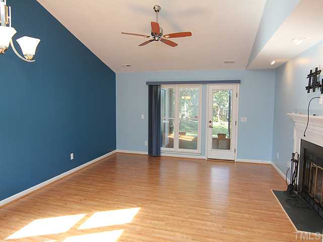 2611 Cottage Circle Raleigh, NC 27613 - Photo 3 of 15 a view of an empty room with a window and a ceiling fan
