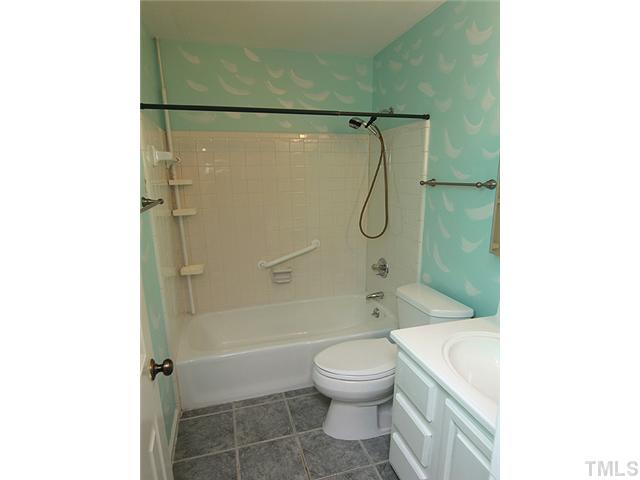 2611 Cottage Circle Raleigh, NC 27613 - Photo 10 of 15 a bathroom with a shower a toilet and sink