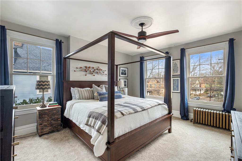 300 Maple Avenue Pittsburgh, PA 15218 - Photo 11 of 25 a bedroom with a large bed and a chandelier fan