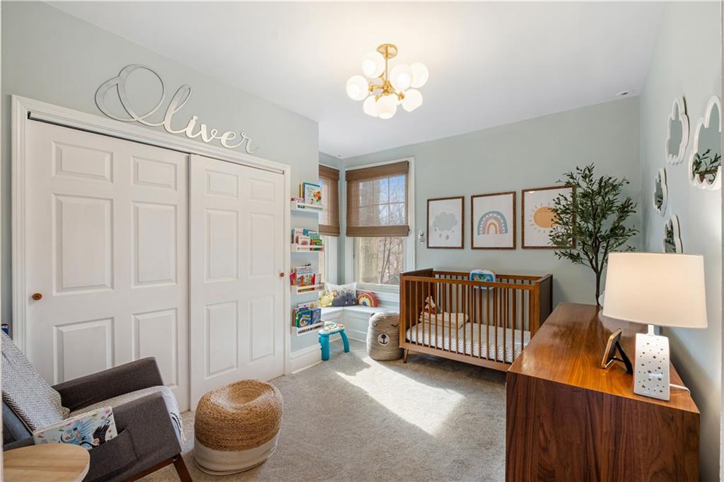 300 Maple Avenue Pittsburgh, PA 15218 - Photo 13 of 25 a bedroom with a bed and a window