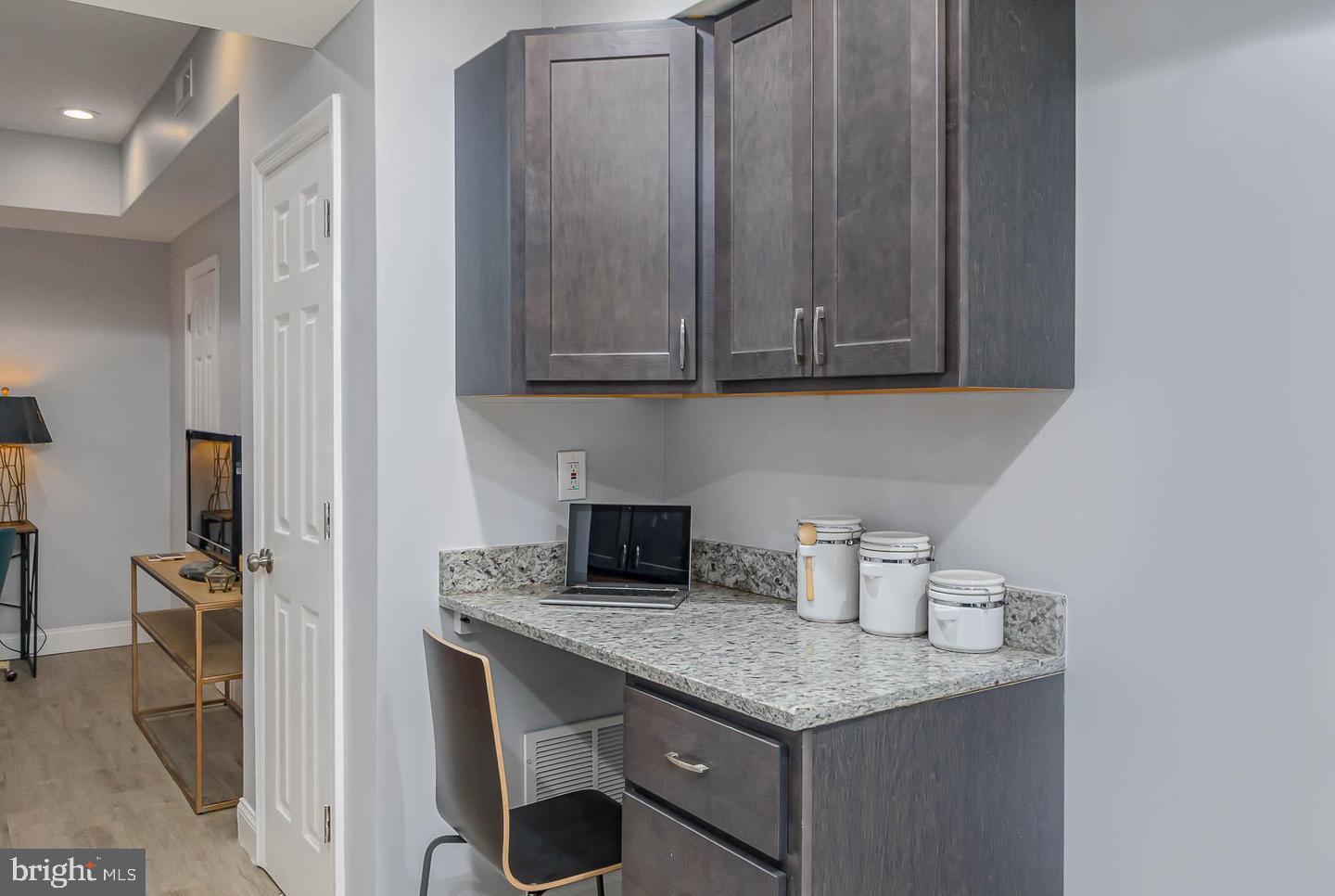 1709 Bank Street Baltimore, MD 21231 - Photo 13 of 49 a kitchen with granite countertop a sink cabinets and appliances