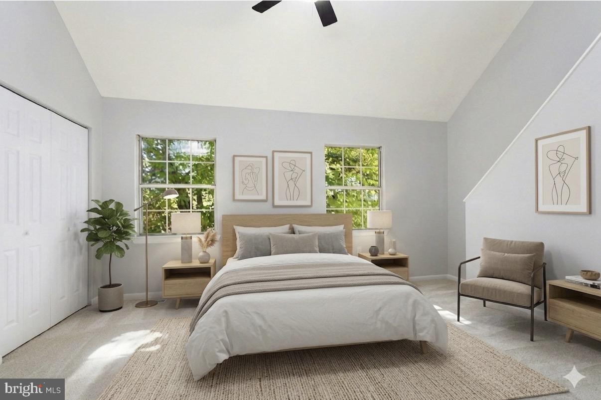 3682 Masthead Trail Triangle, VA 22172 - Photo 23 of 53 a bedroom with a large bed and a potted plant