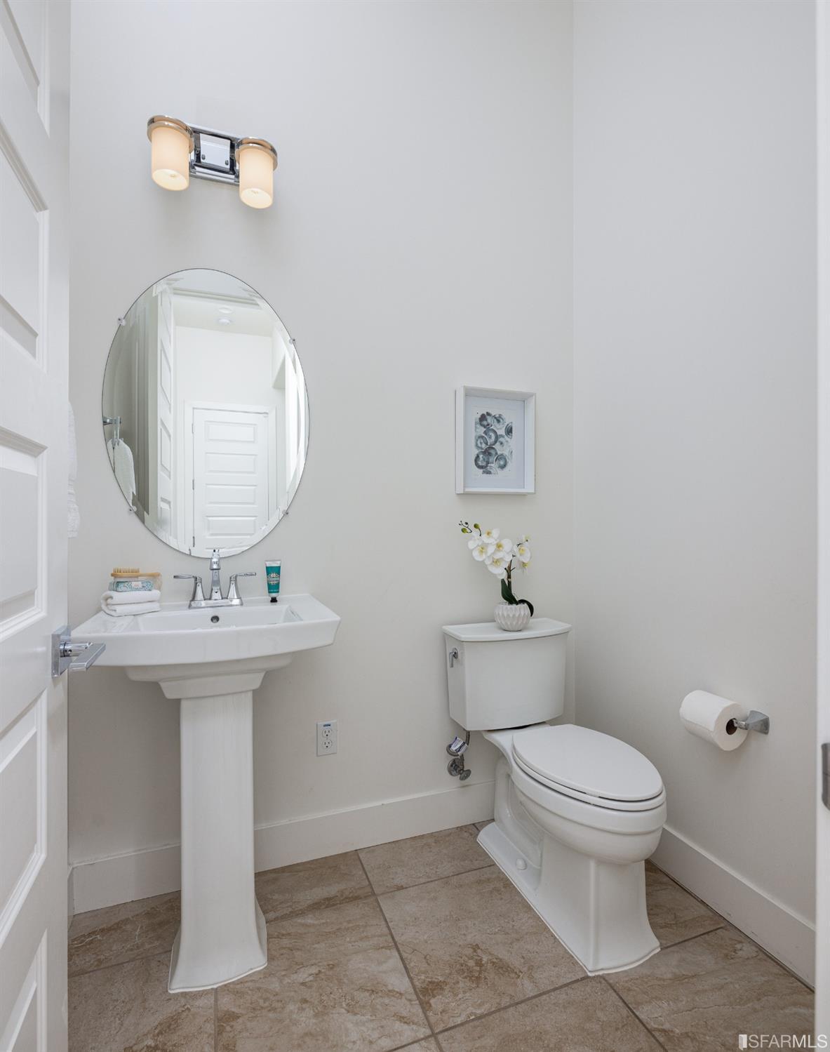 30 Wilder Road Orinda, CA 94563 - Photo 12 of 57 a bathroom with a toilet a sink and mirror