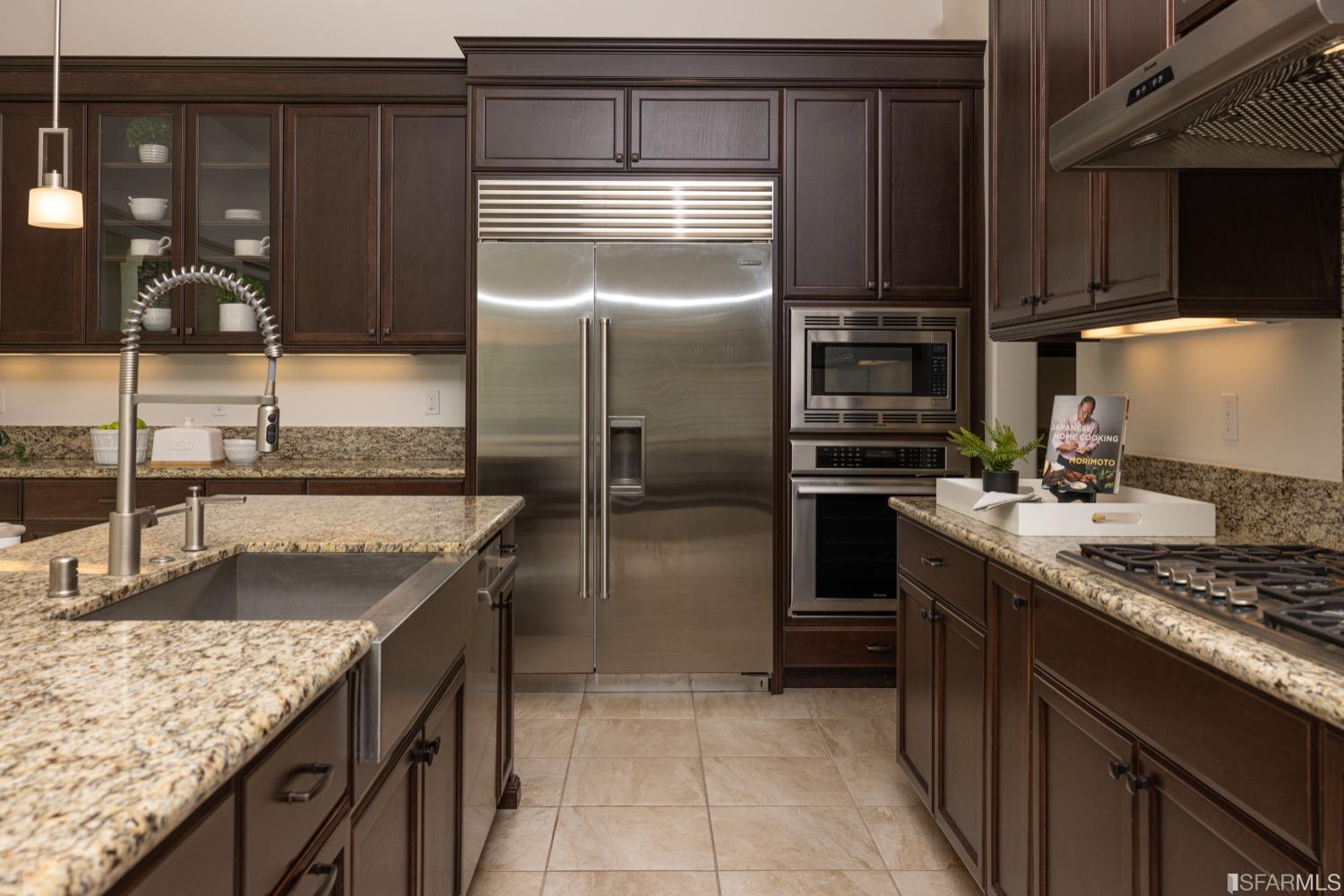 30 Wilder Road Orinda, CA 94563 - Photo 27 of 57 a kitchen with kitchen island granite countertop a sink stove and refrigerator