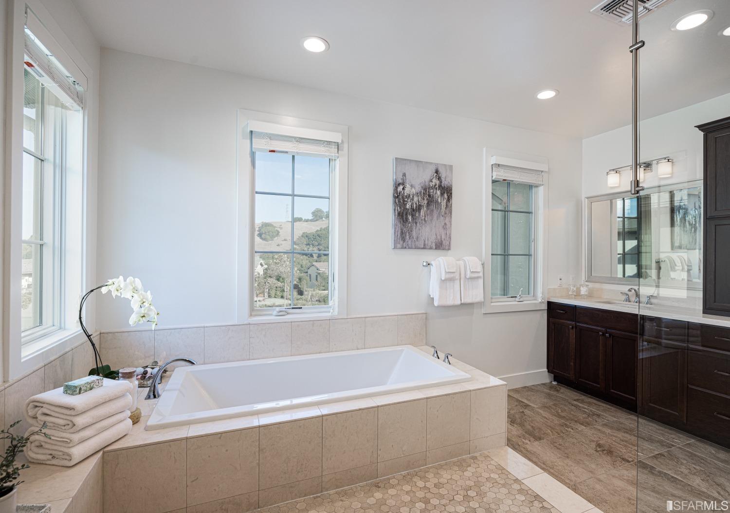 30 Wilder Road Orinda, CA 94563 - Photo 34 of 57 a bathroom with a tub sink and mirror