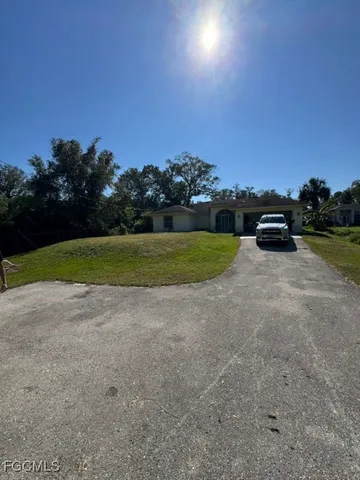 a view of a golf course with green space