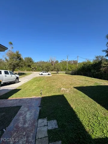 a view of a lake with a yard