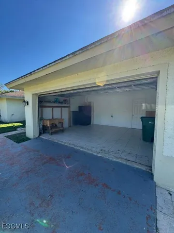 a view of empty room with a fireplace