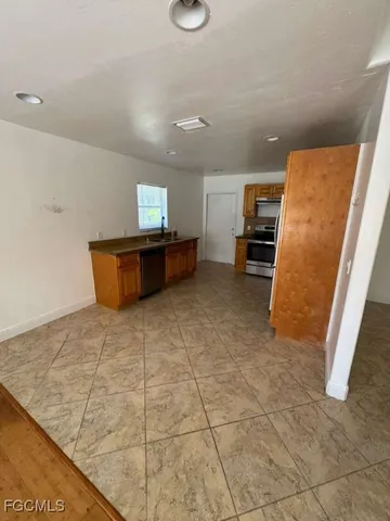 a view of kitchen with furniture and window