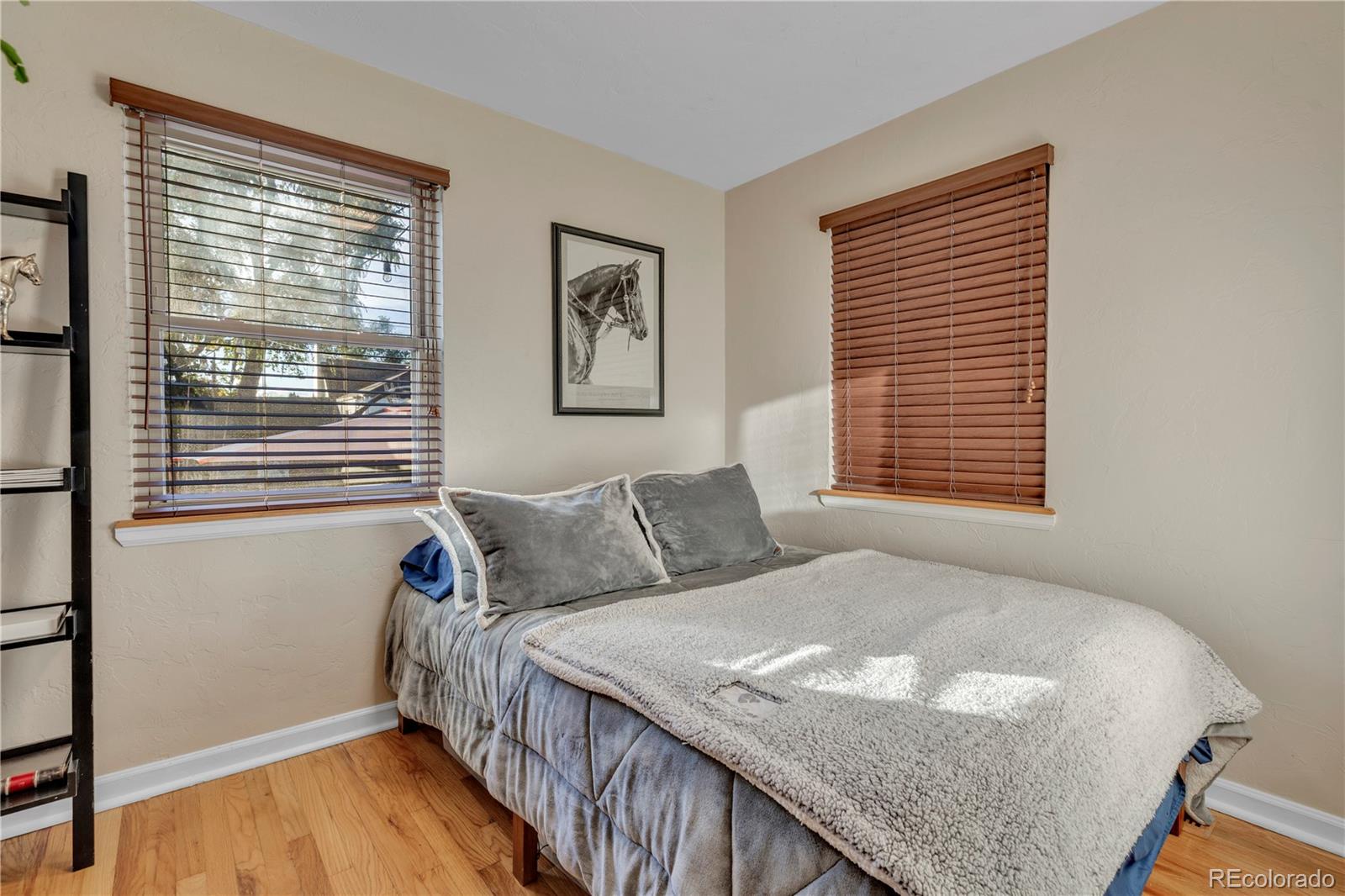 2651 Adams Street Denver, CO 80205 - Photo 15 of 37 a bedroom with a bed and a window