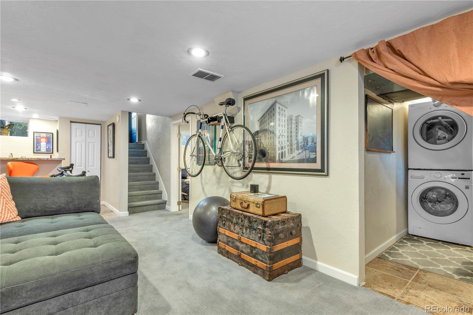 2651 Adams Street Denver, CO 80205 - Photo 27 of 37 a bedroom with furniture and a mirror