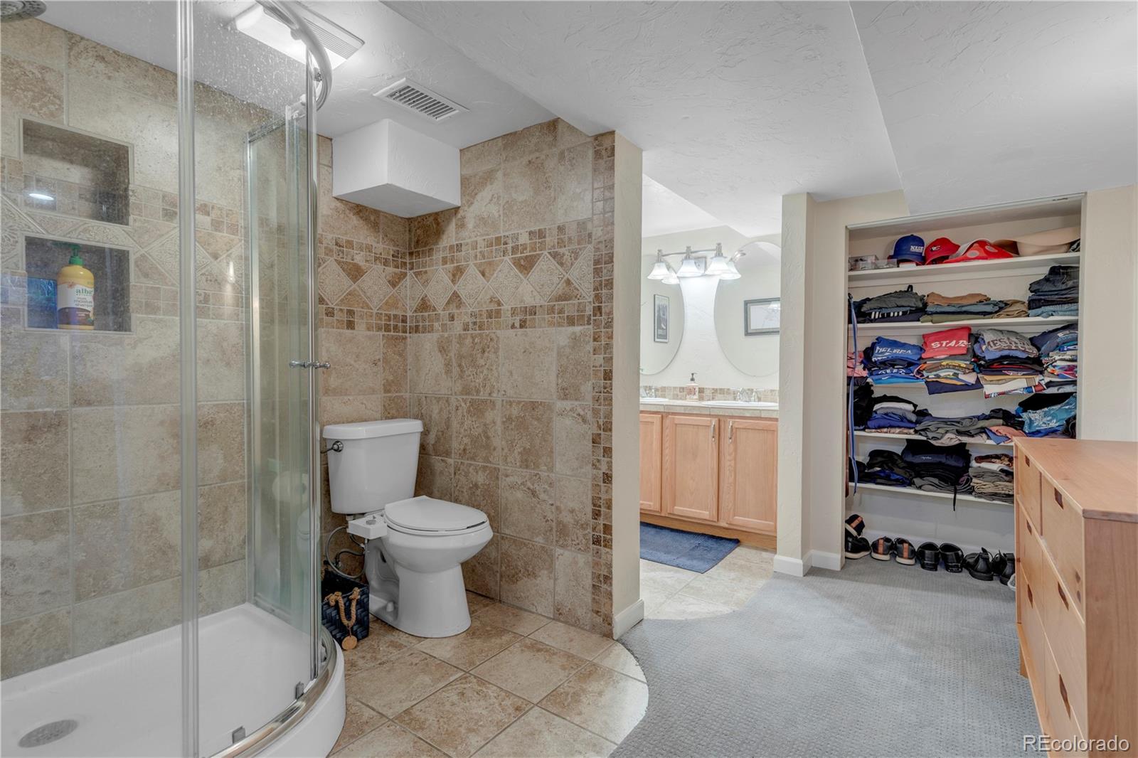 2651 Adams Street Denver, CO 80205 - Photo 29 of 37 a bathroom with a toilet and a shower
