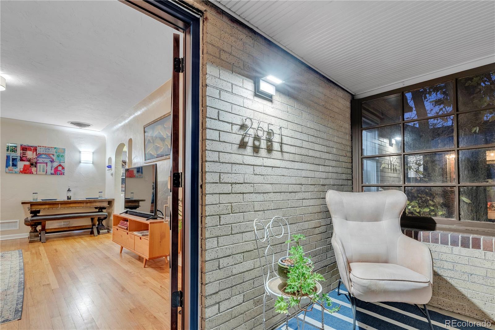 2651 Adams Street Denver, CO 80205 - Photo 6 of 37 a view of a living room and dining room