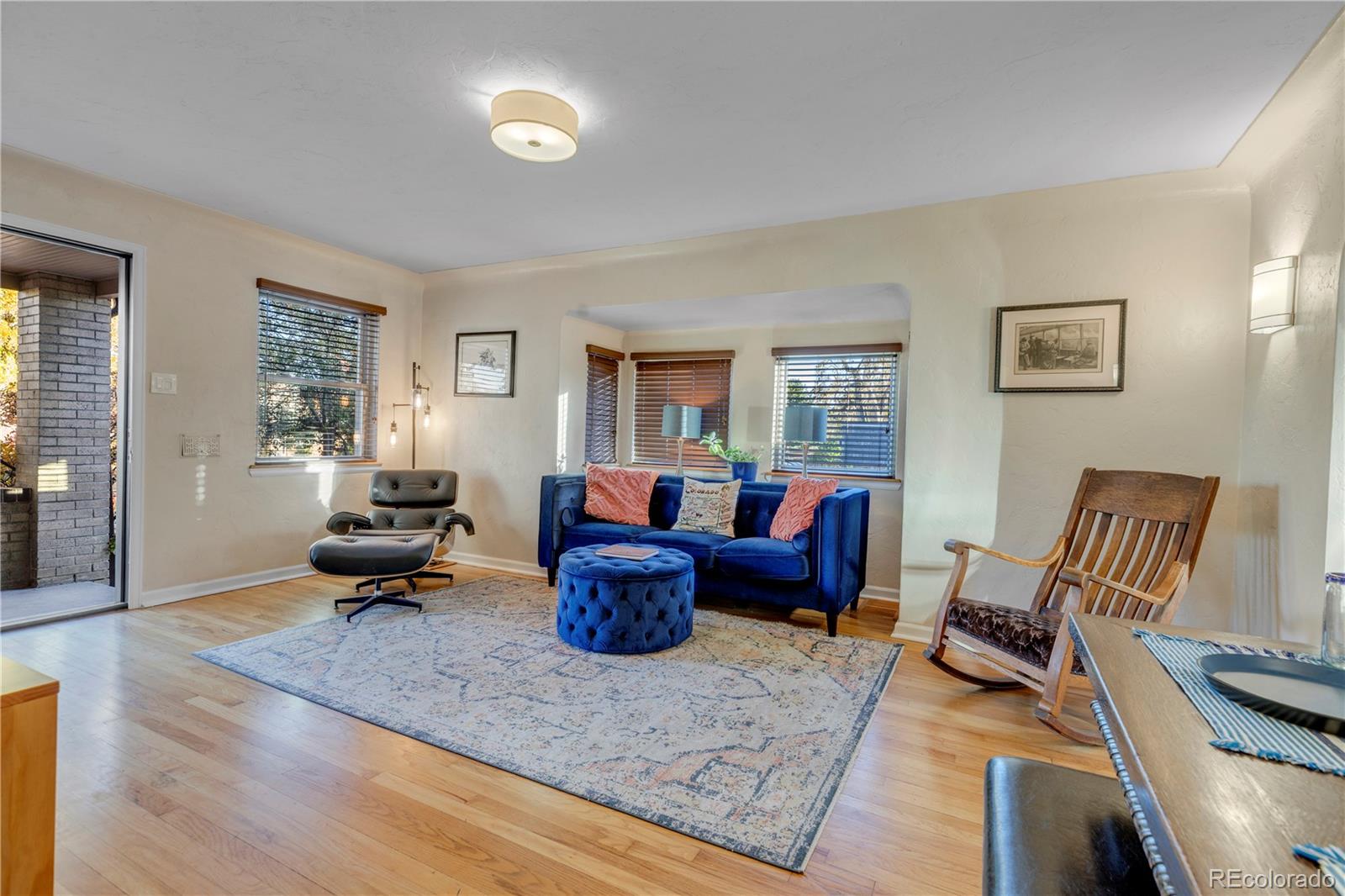 2651 Adams Street Denver, CO 80205 - Photo 10 of 37 a living room with furniture rug and window