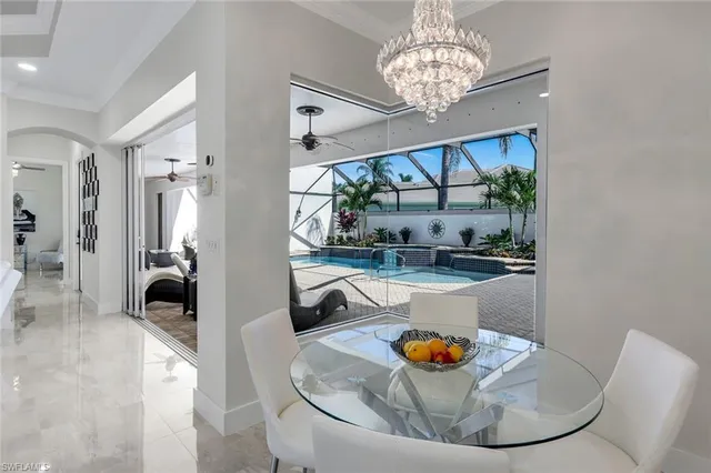 a kitchen with stainless steel appliances granite countertop a refrigerator a stove and a sink